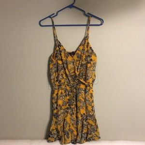 Super cute yellow floral print flowy romper